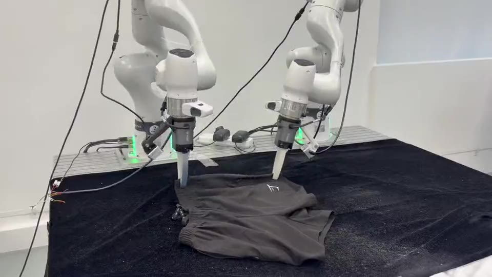 Two Franka arms folding a pair of pants